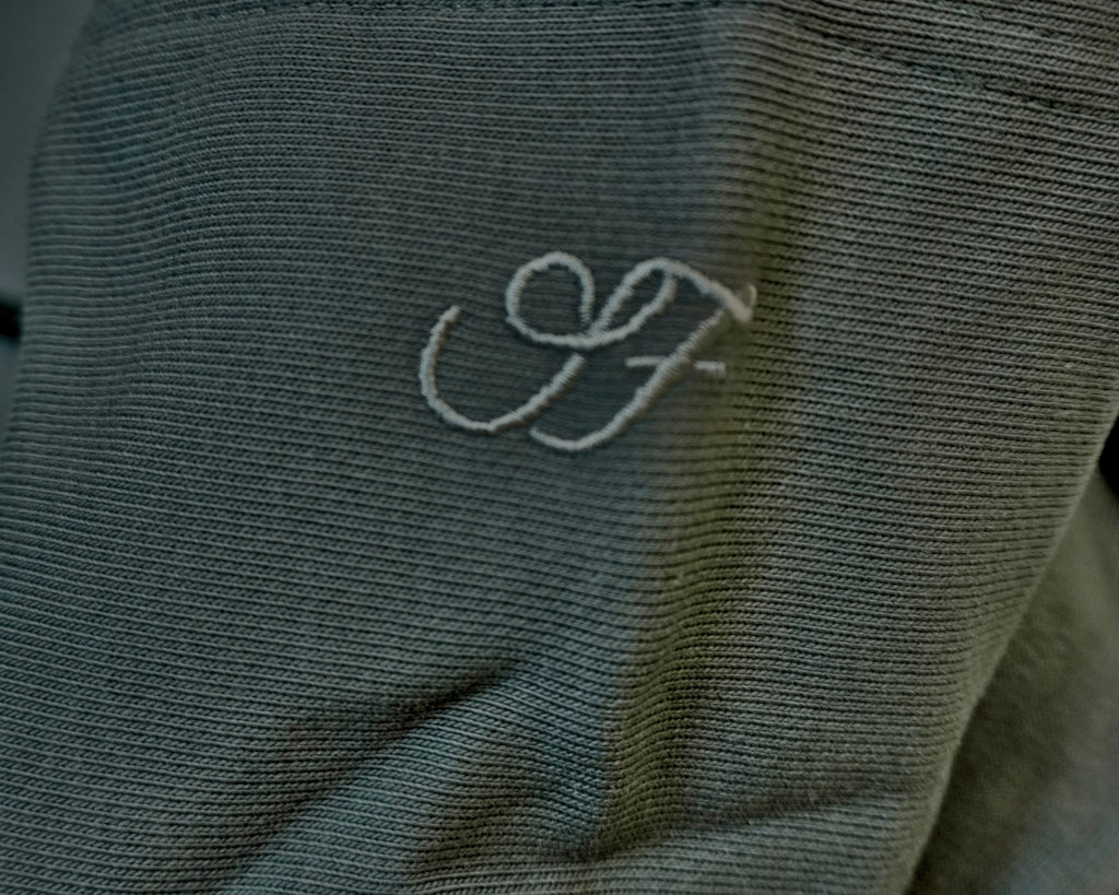 Charcoal grey Saltus Fidei hoodie, close-up product detail