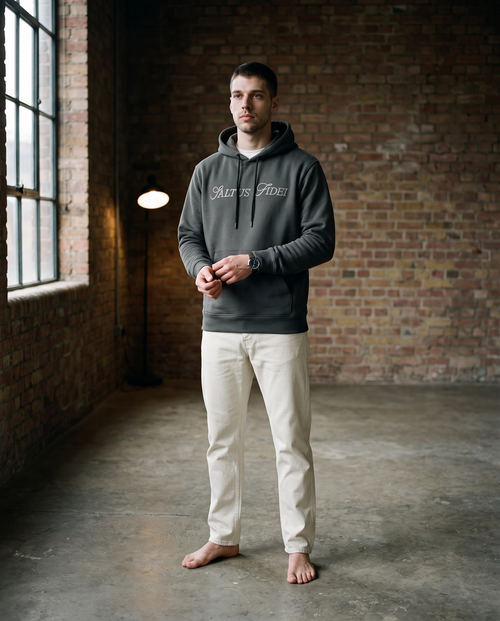 Charcoal grey Saltus Fidei hoodie worn by a model, studio lifestyle shot